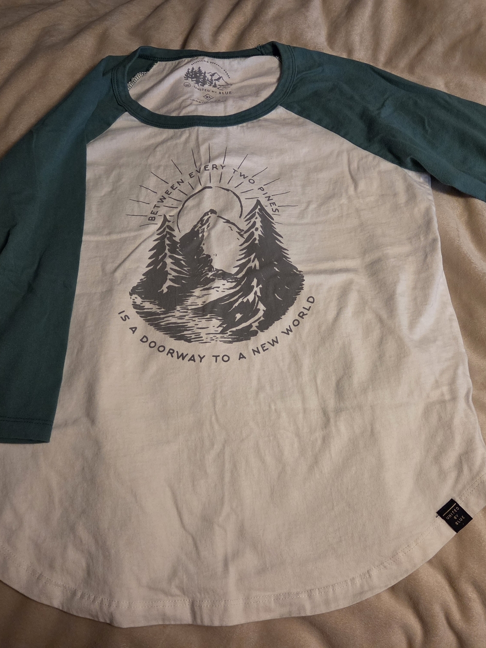 United By Blue White Tee with Teal Raglan Sleeves and Mountain Graphic